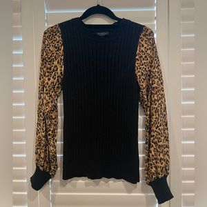 Boutique brand black sweater with leopard sleeves